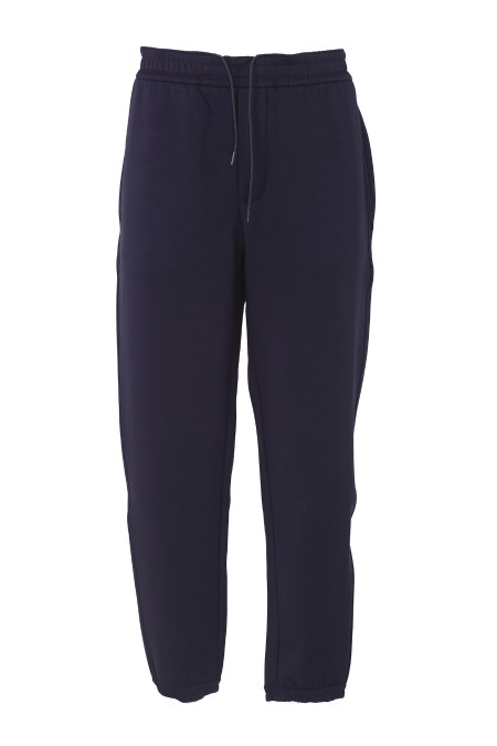 Shop EMPORIO ARMANI  Trousers: Emporio Armani Travel Essential double jersey jogger trousers.
Double jersey.
Elastic waist with drawstring.
Side welt pockets.
Tonal thin side bands.
Rear welt pockets.
Collector's patch on the back.
Composition: 48% Polyester, 46% Modal, 6% Elastane.
Made in Cambodia.. EM000084 AF10103-UB118